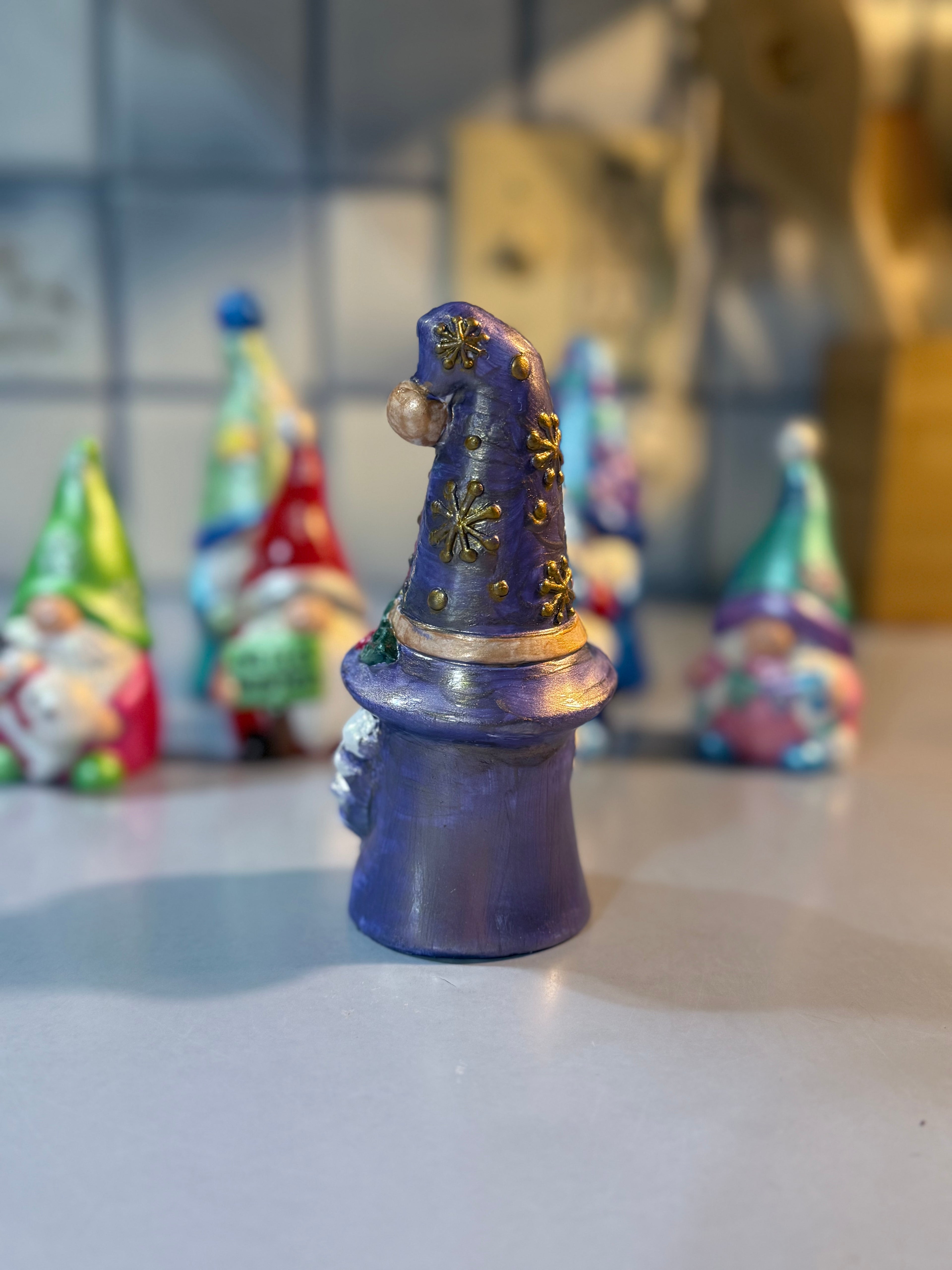 Whimsical Christmas Gnome intricately hand painted with shades of metallic and iridescent color and some iridescent glitter for shimmer ￼￼￼