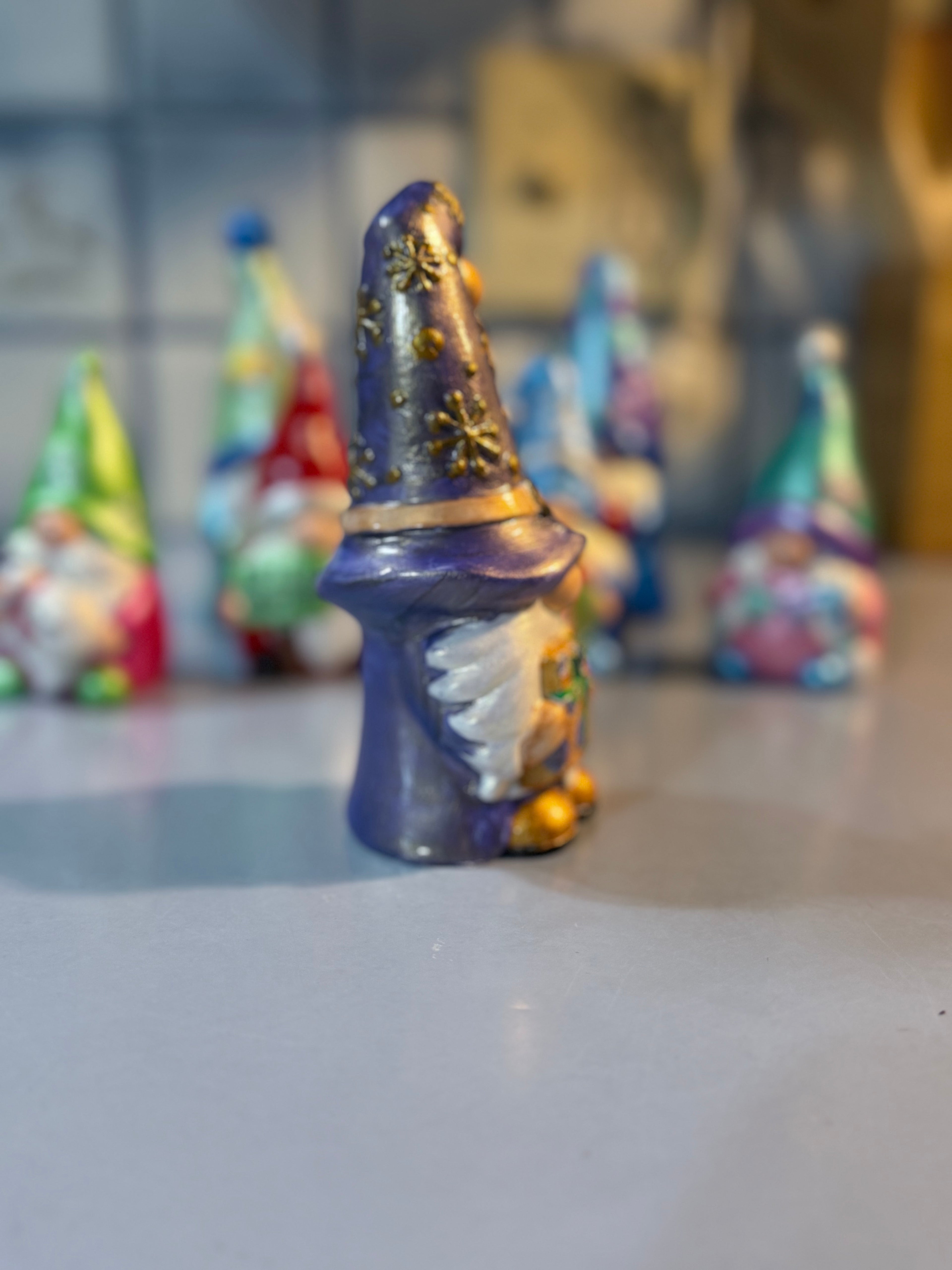 Whimsical Christmas Gnome intricately hand painted with shades of metallic and iridescent color and some iridescent glitter for shimmer ￼￼￼