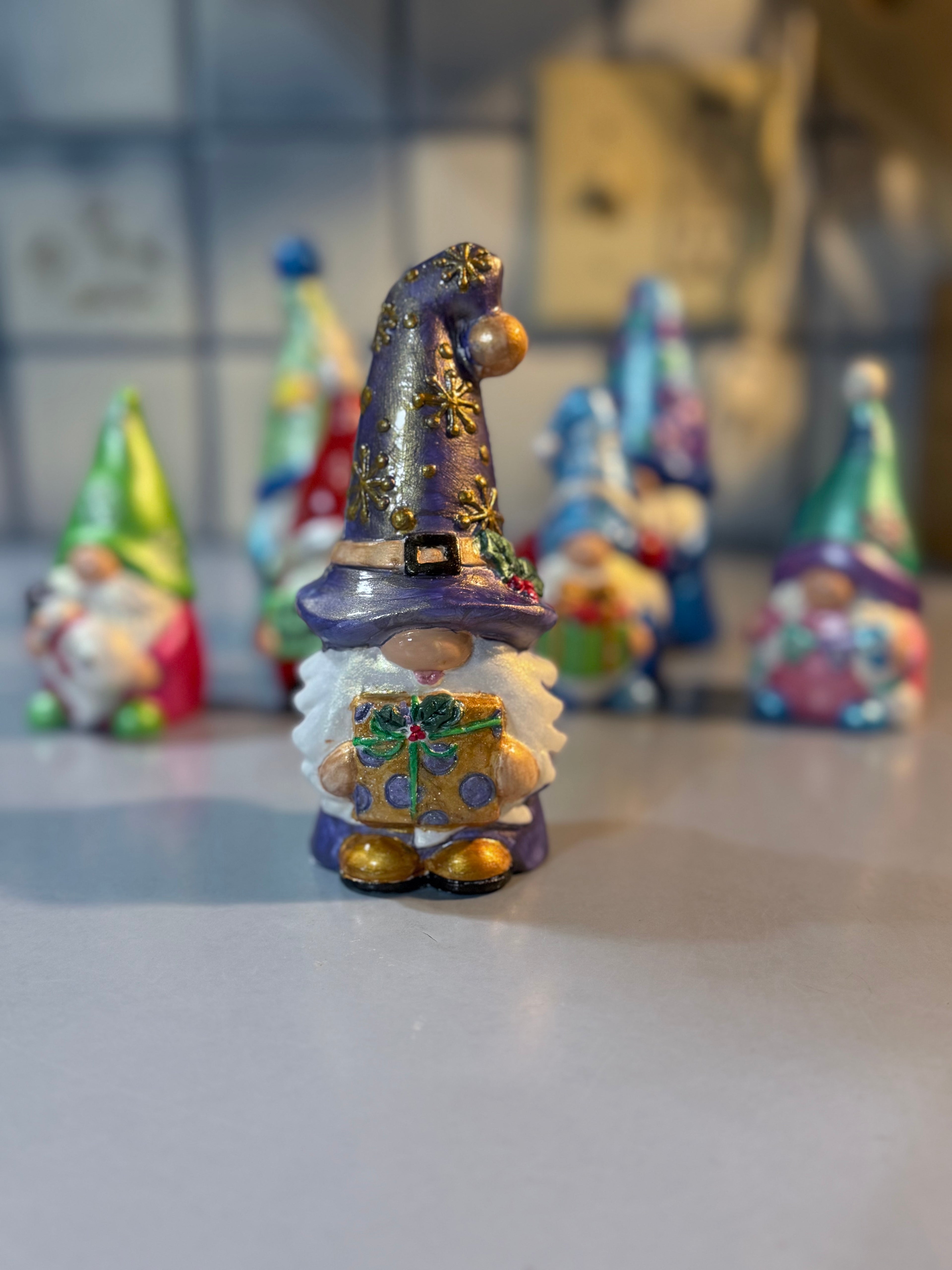 Whimsical Christmas Gnome intricately hand painted with shades of metallic and iridescent color and some iridescent glitter for shimmer ￼￼￼
